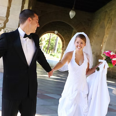 A picture of a bride and groom in the cloisters, Glasgow University.